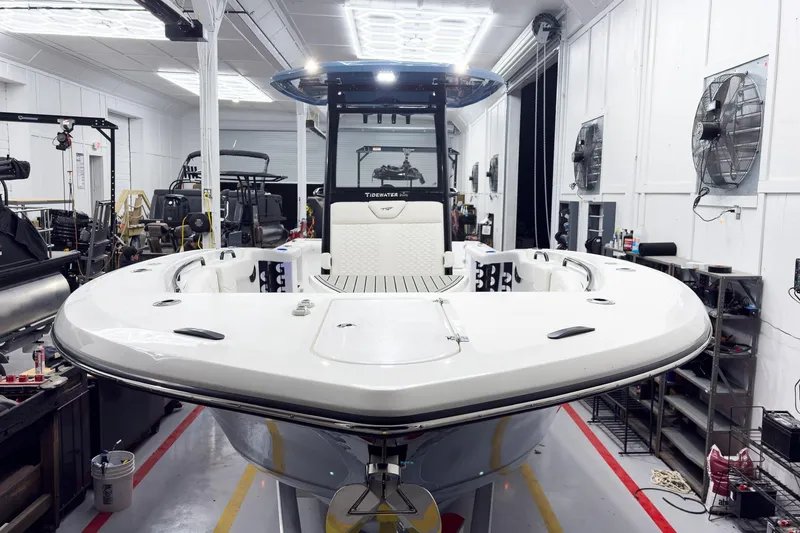 Slide: The Image of 2026 Tidewater 272 CC Adventure boat in a workshop setting. - 56