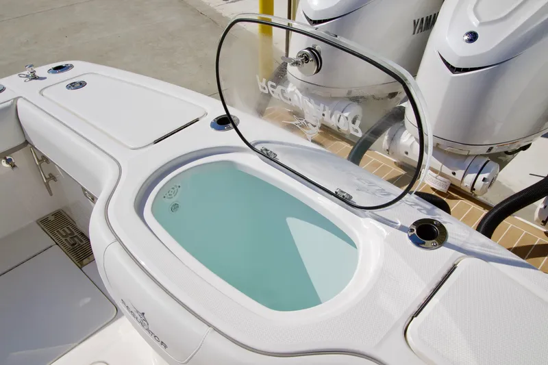 Slide: The Image of 2027 Regulator 35 boat with open livewell and Yamaha engines. - 40