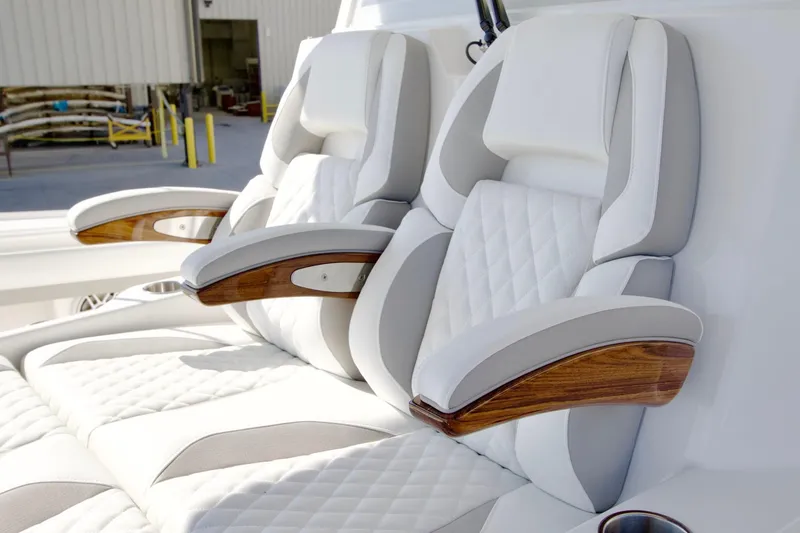 Slide: The Image of Luxurious seating on 2027 Regulator 35 boat with elegant wood accents and quilted upholstery. - 19