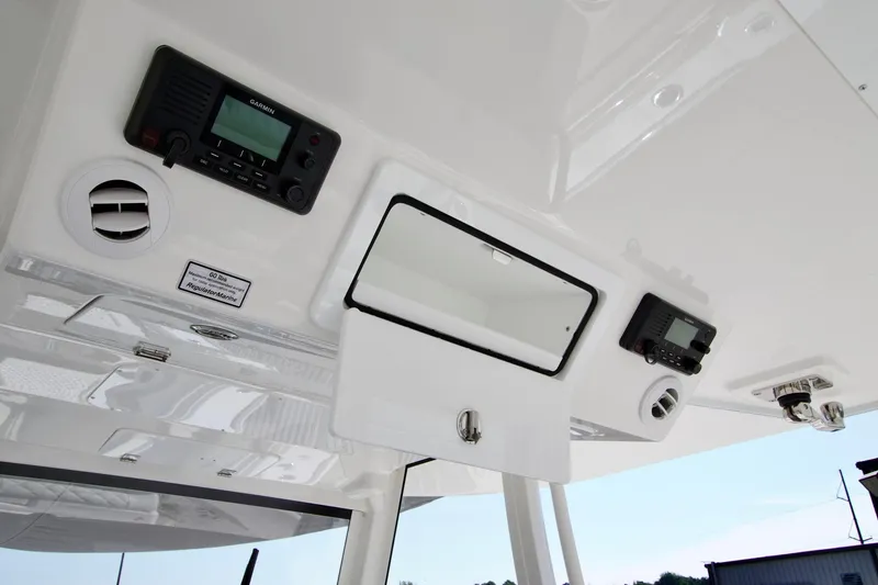 Slide: The Image of 2027 Regulator 35 boat console with electronic controls and storage compartment. - 43