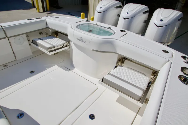 Slide: The Image of 2027 Regulator 35 boat interior with seating and Yamaha engines. - 38