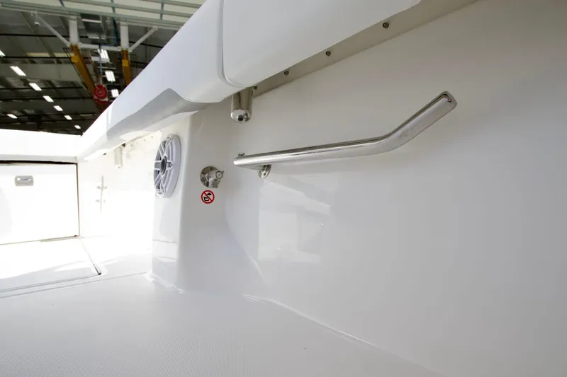 Slide: The Image of 2027 Regulator 35 boat interior with stainless steel handrail and speaker. - 28