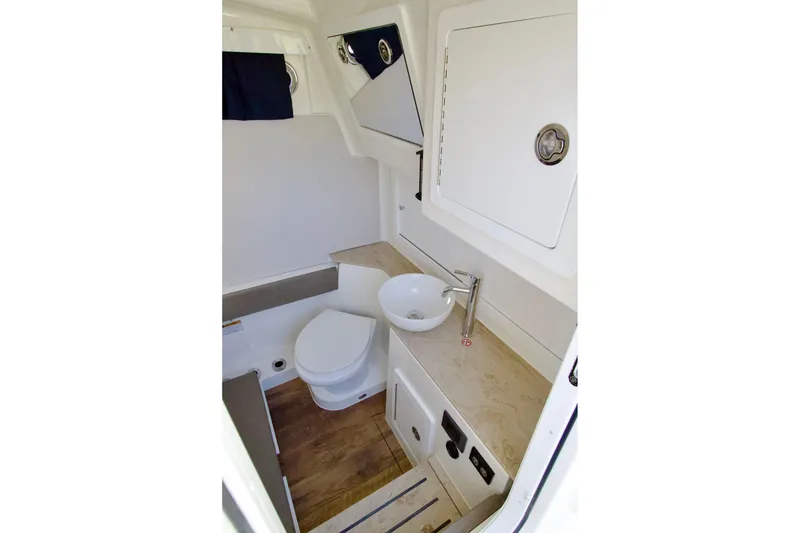 Slide: The Image of Modern bathroom interior on 2027 Regulator 35 boat, featuring sink and toilet. - 21