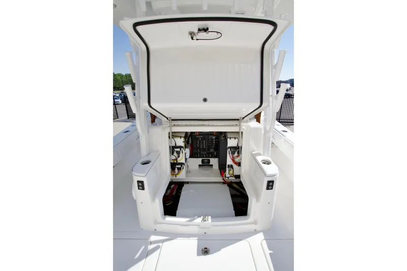 Slide: The Image of 2027 Regulator 35 boat electrical compartment with open hatch, showcasing wiring and components. - 36