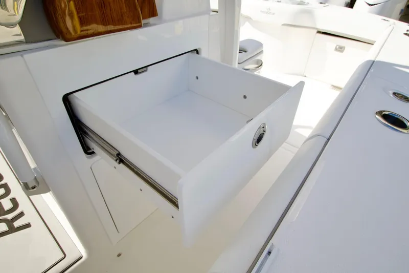 Slide: The Image of Open storage drawer on 2027 Regulator 35 boat, showcasing sleek design and functionality. - 30