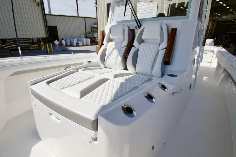 Slide: The Image of Luxurious seating on 2027 Regulator 35 boat with quilted upholstery and cup holders. - 16