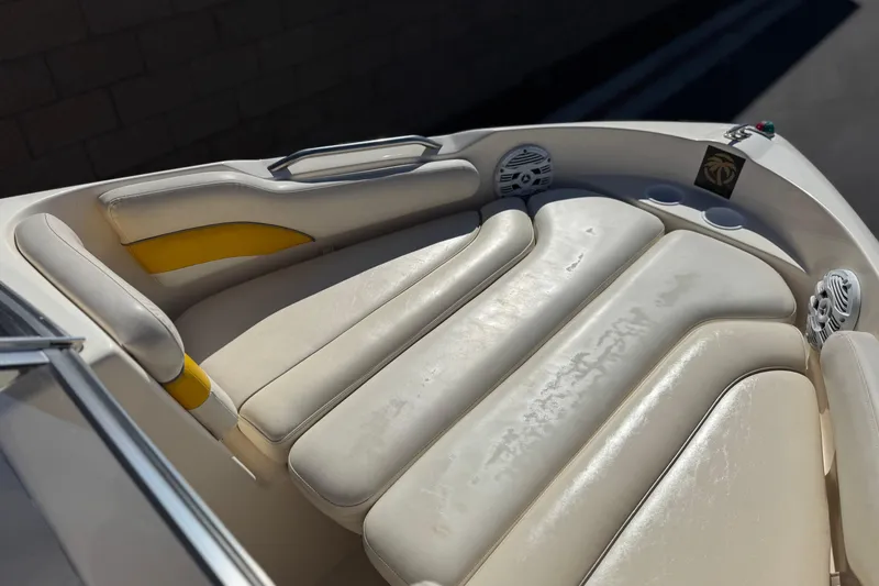 Slide: The Image of 2003 Rinker 192 Captiva Bowrider interior with cream and yellow seating. - 11
