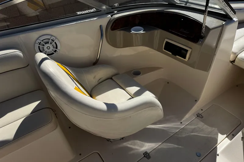 Slide: The Image of 2003 Rinker 192 Captiva Bowrider interior with seating and dashboard details. - 19