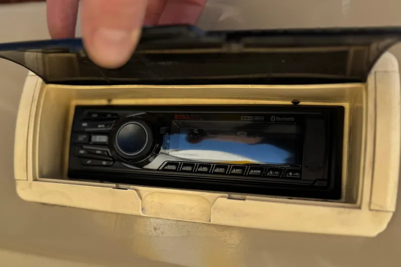 Slide: The Image of Boat stereo system in a 2003 Rinker 192 Captiva Bowrider, featuring Bluetooth connectivity. - 20