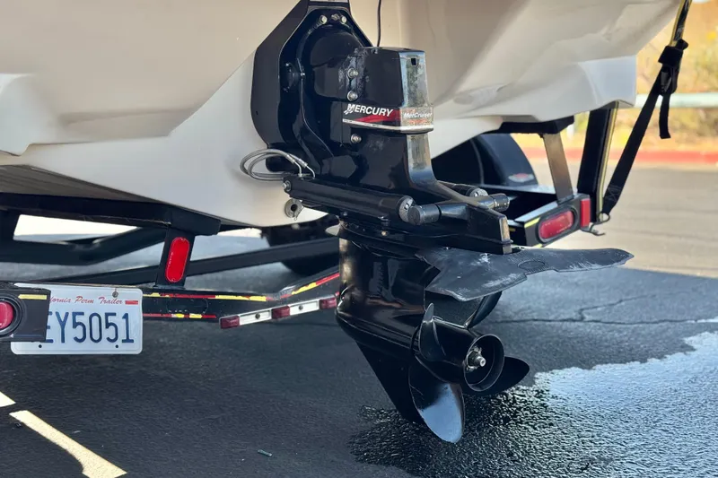 Slide: The Image of 2003 Rinker 192 Captiva Bowrider with Mercury outboard motor on trailer. - 7