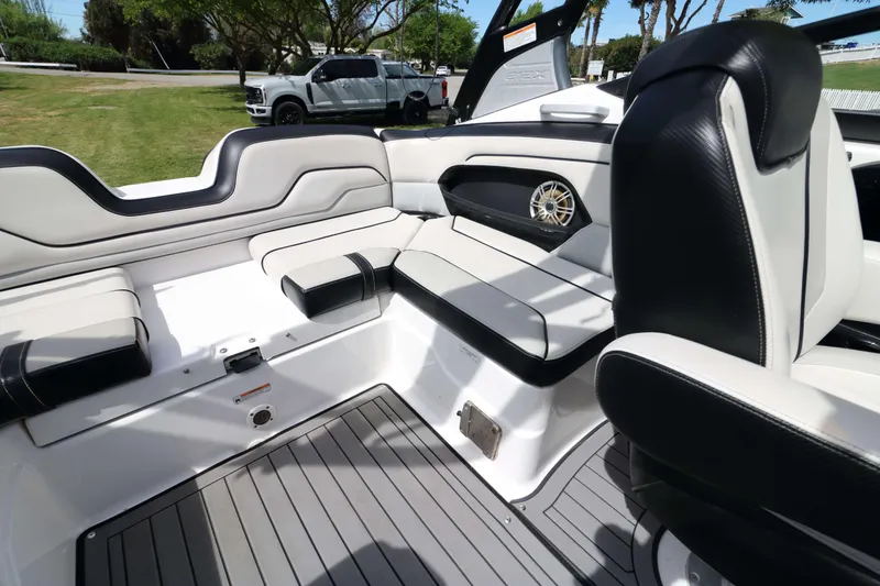 Slide: The Image of 2017 Yamaha Boats 212X interior with sleek seating and modern design. - 14