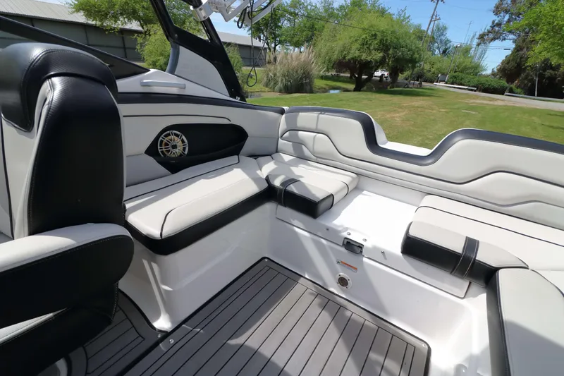 Slide: The Image of 2017 Yamaha Boats 212X interior with sleek seating and modern design. - 15