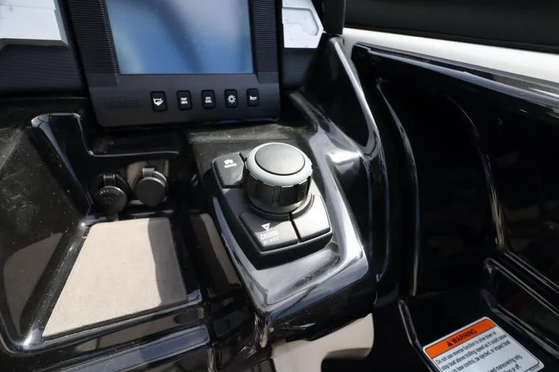 Slide: The Image of Control panel of a 2017 Yamaha Boats 212X, featuring navigation and cruise controls. - 16
