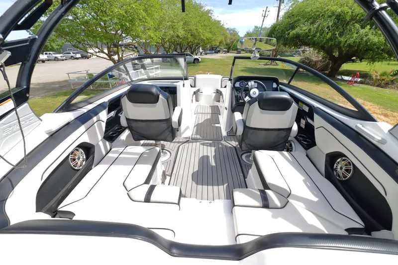 Slide: The Image of 2017 Yamaha Boats 212X interior with sleek seating and modern dashboard design. - 8