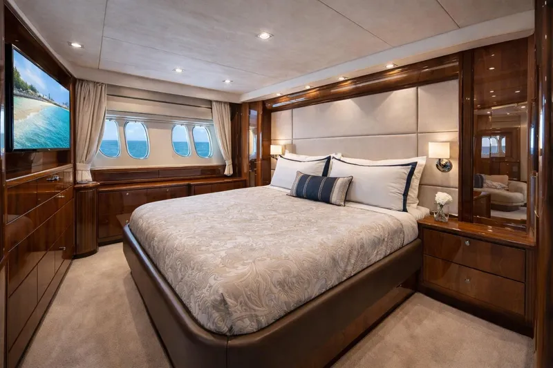 Slide: The Image of Luxurious bedroom interior of 2014 Azimut 48 yacht with elegant wood finishes and ocean view. - 12