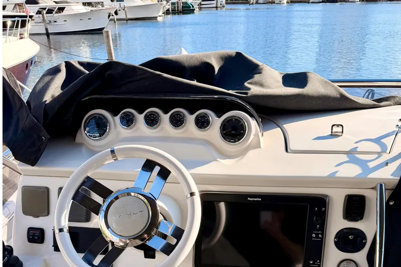 Slide: The Image of Cockpit of 2014 Azimut 48 yacht with steering wheel and navigation instruments. - 13