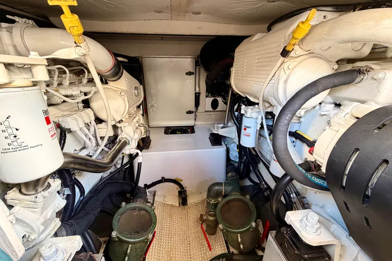 Slide: The Image of Engine room of a 2014 Azimut 48 yacht, showcasing dual engines and mechanical components. - 15