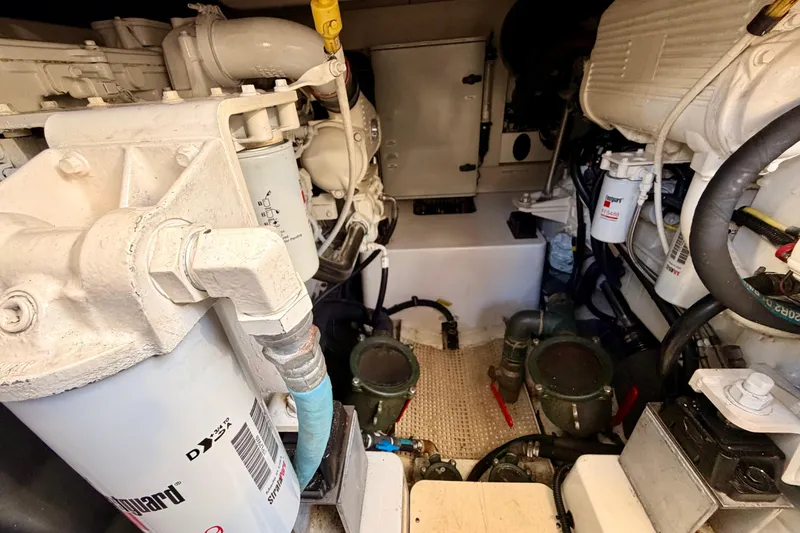 Slide: The Image of Engine room of a 2014 Azimut 48 yacht, showcasing mechanical components and filters. - 17