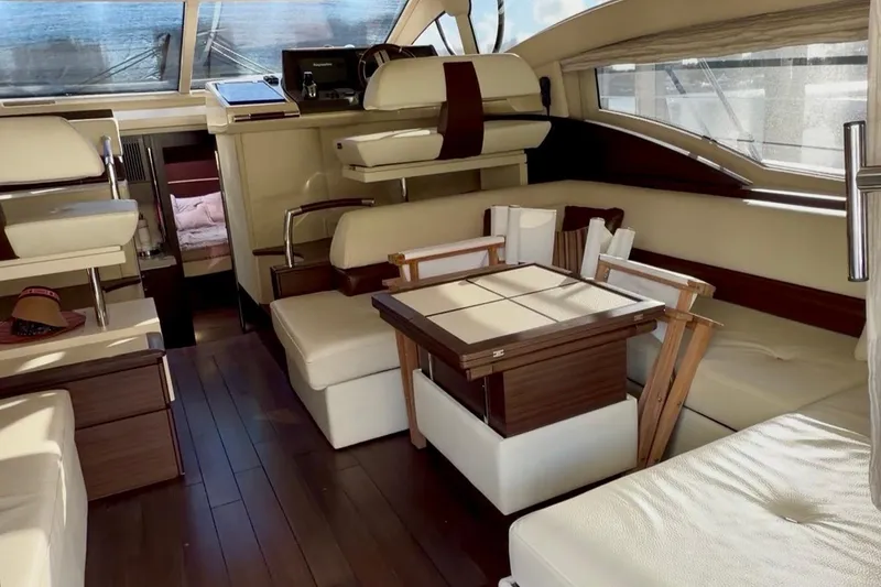 Slide: The Image of Luxurious interior of a 2014 Azimut 48 yacht with elegant seating and wooden accents. - 7