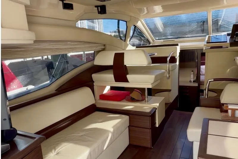 Slide: The Image of Luxurious interior of a 2014 Azimut 48 yacht with elegant seating and wood accents. - 8