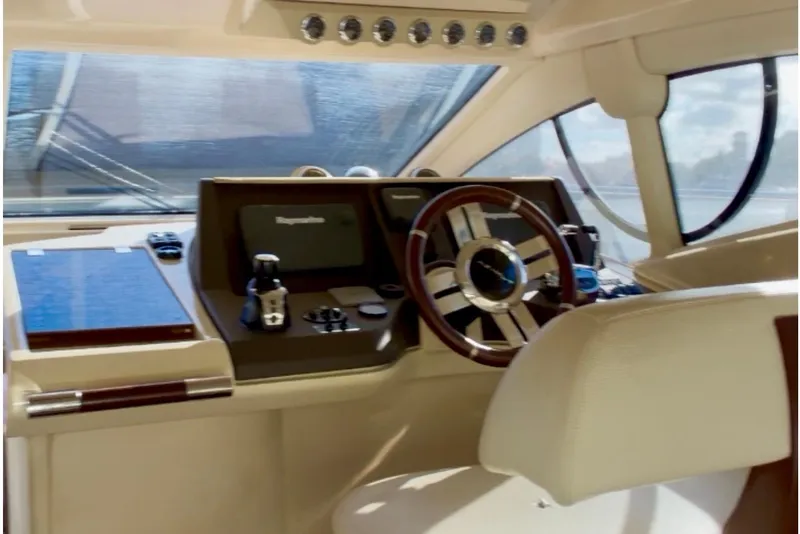 Slide: The Image of Helm of 2014 Azimut 48 yacht with modern controls and steering wheel. - 9