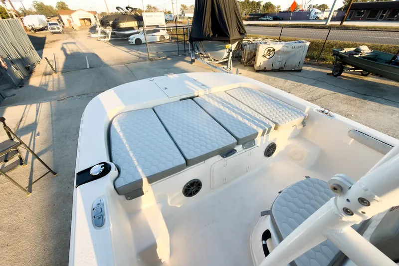 Slide: The Image of 2026 Carolina Skiff 19 LS boat interior with cushioned seating and storage compartments. - 11