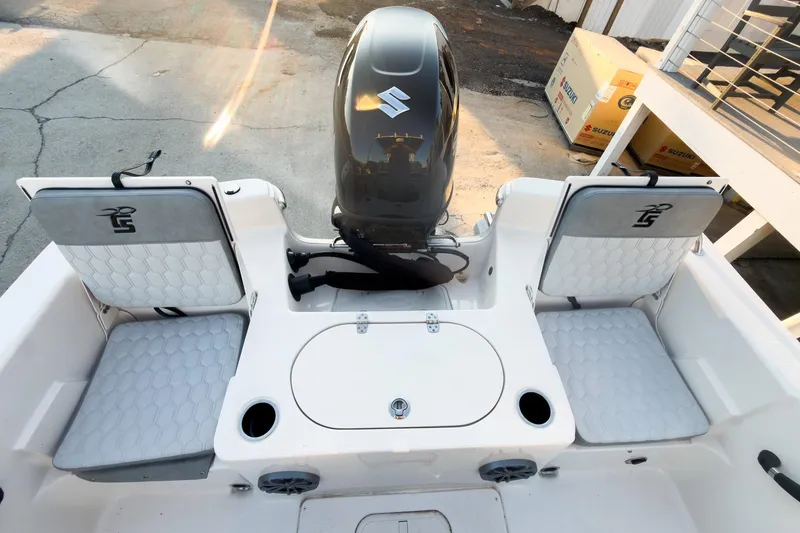 Slide: The Image of 2026 Carolina Skiff 19 LS boat interior with seating and motor, showcasing modern design. - 24
