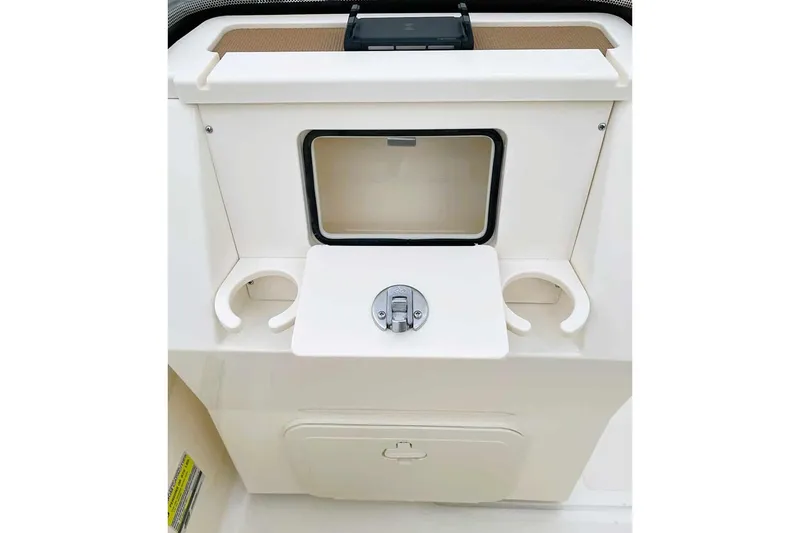 Slide: The Image of Manufacturer Provided Image: 2025 Scout 175 Sport Dorado boat console with cup holders and storage compartment. - 10