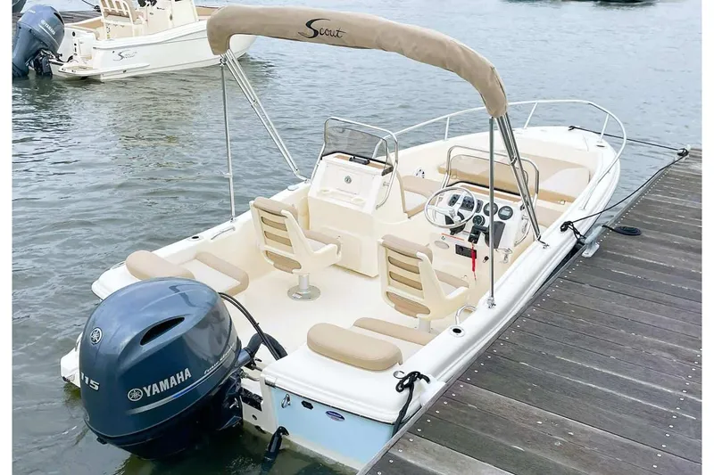 Slide: The Image of Manufacturer Provided Image: 2025 Scout 175 Sport Dorado boat docked with Yamaha outboard motor. - 2