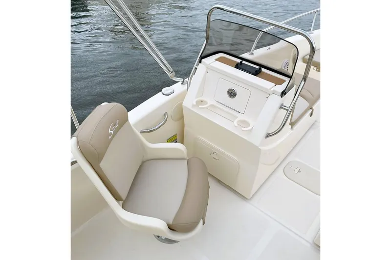 Slide: The Image of Manufacturer Provided Image: 2025 Scout 175 Sport Dorado boat interior with beige seating and console. - 7
