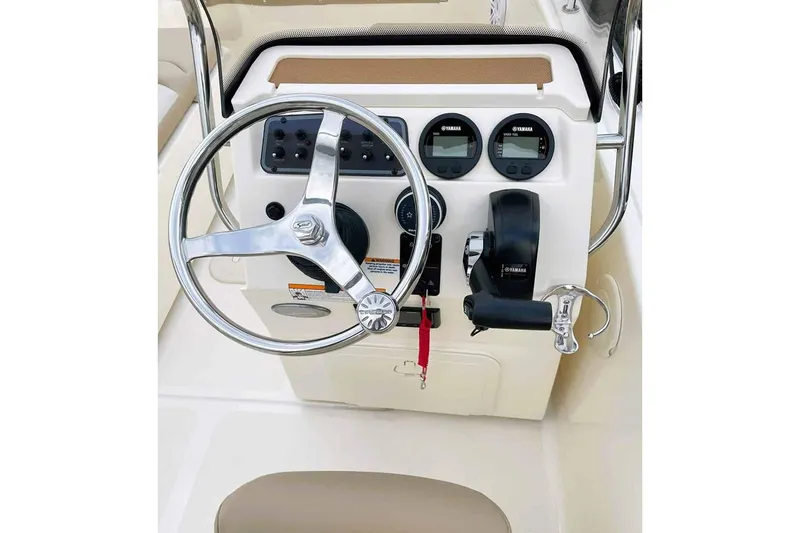 Slide: The Image of Manufacturer Provided Image: 2025 Scout 175 Sport Dorado boat dashboard with steering wheel and controls. - 8