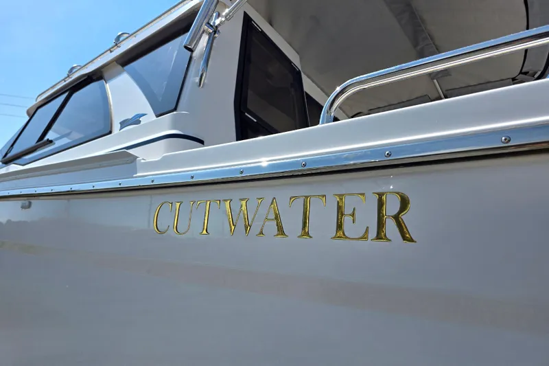 Slide: The Image of 2026 Cutwater C-248 Coupe boat with sleek design and gold lettering. - 16