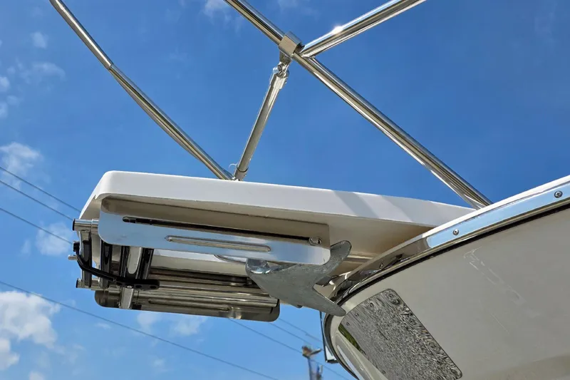 Slide: The Image of Cutwater C-248 Coupe 2026 boat anchor and ladder against clear blue sky. - 17