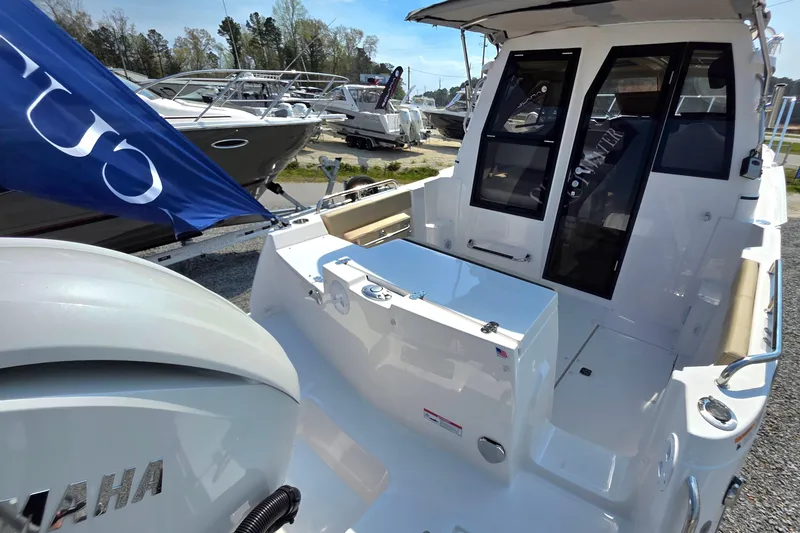 Slide: The Image of 2026 Cutwater C-248 Coupe boat with Yamaha engine, docked outdoors. - 3
