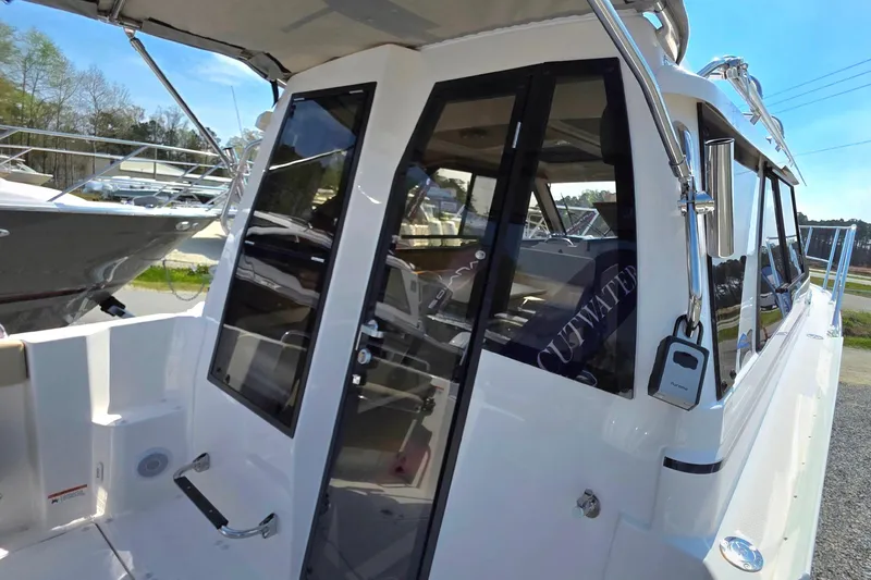 Slide: The Image of 2026 Cutwater C-248 Coupe boat exterior with sleek design and modern features. - 6