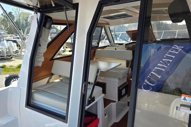 Slide: The Image of 2026 Cutwater C-248 Coupe interior with seating and table, showcasing modern design. - 7