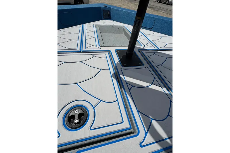 Slide: The Image of 2026 SeaArk Shadow 187T boat deck with blue and white patterned design. - 10
