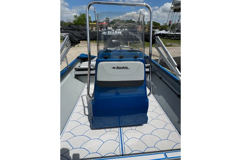 Slide: The Image of 2026 SeaArk Shadow 187T boat with blue console and patterned deck. - 11