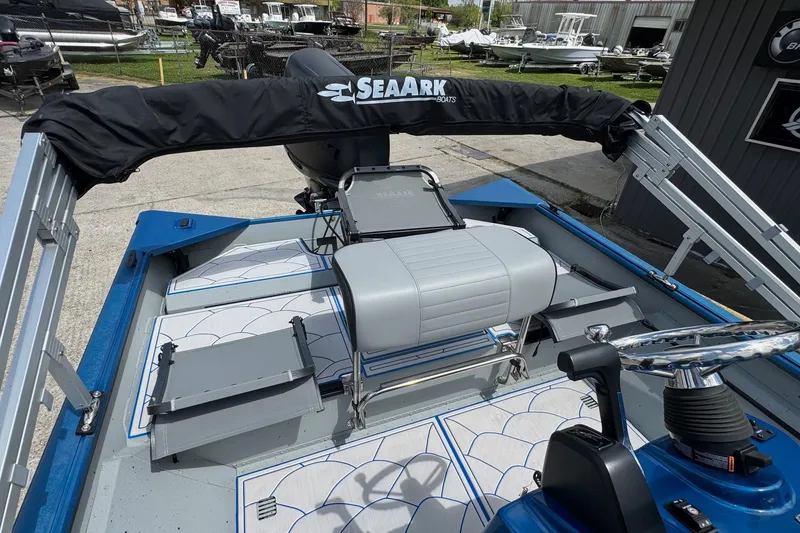 Slide: The Image of 2026 SeaArk Shadow 187T boat interior with seating and steering wheel. - 12