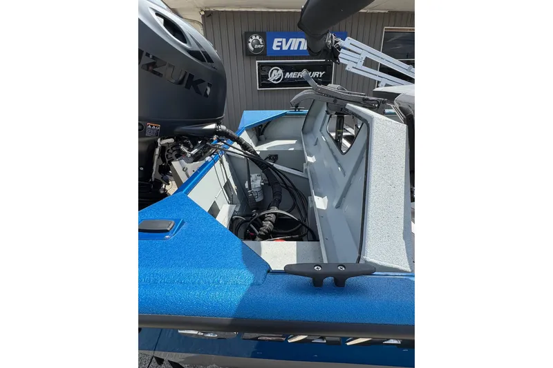 Slide: The Image of 2026 SeaArk Shadow 187T boat interior with Suzuki engine, showcasing storage and equipment. - 18