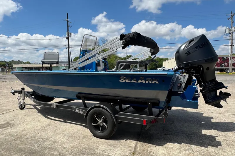 Slide: The Image of 2026 SeaArk Shadow 187T boat with Suzuki outboard motor on trailer, parked outdoors. - 4