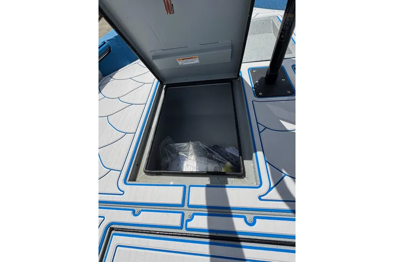 Slide: The Image of Open storage compartment on 2026 SeaArk Shadow 187T boat deck. - 8