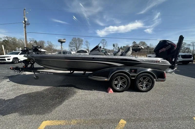 The Image of 2023 Ranger Z520R boat on trailer under clear sky. - 1
