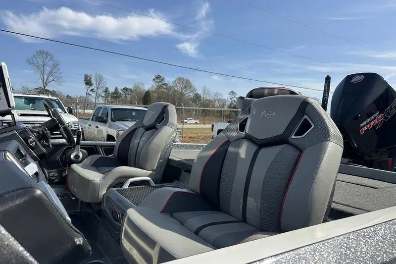 Slide: The Image of 2023 Ranger Z520R boat interior with gray seats and Mercury Pro XS engine. - 11