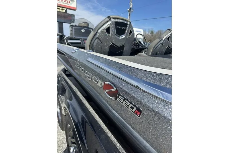 Slide: The Image of 2023 Ranger Z520R boat with sleek design and metallic finish. - 6