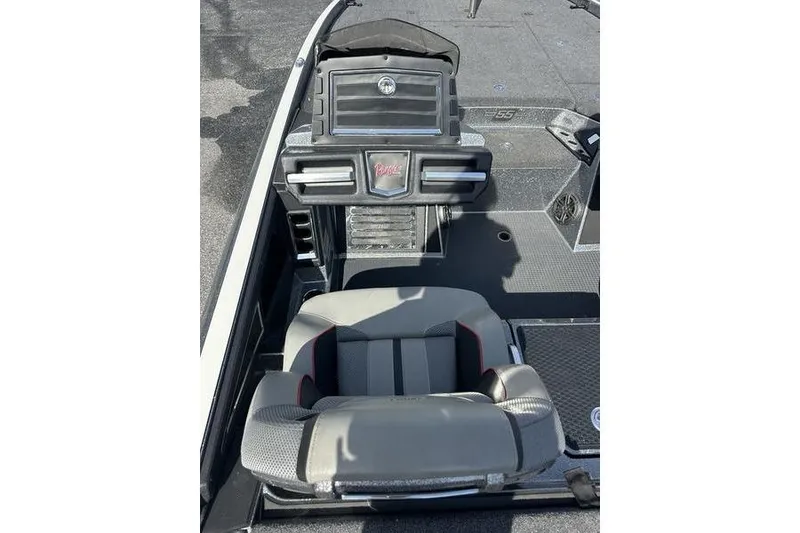 Slide: The Image of 2023 Ranger Z520R boat interior with steering console and cushioned seat. - 7