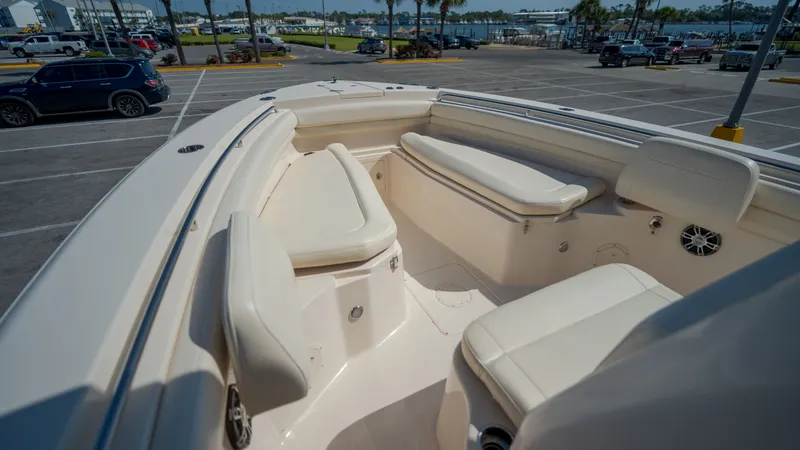 Slide: The Image of 2019 Grady-White Canyon 306 boat with seating area in harbor. - 10