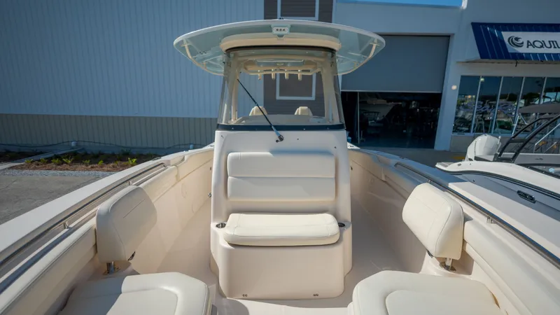 Slide: The Image of 2019 Grady-White Canyon 306 boat with outdoor seating area. - 13