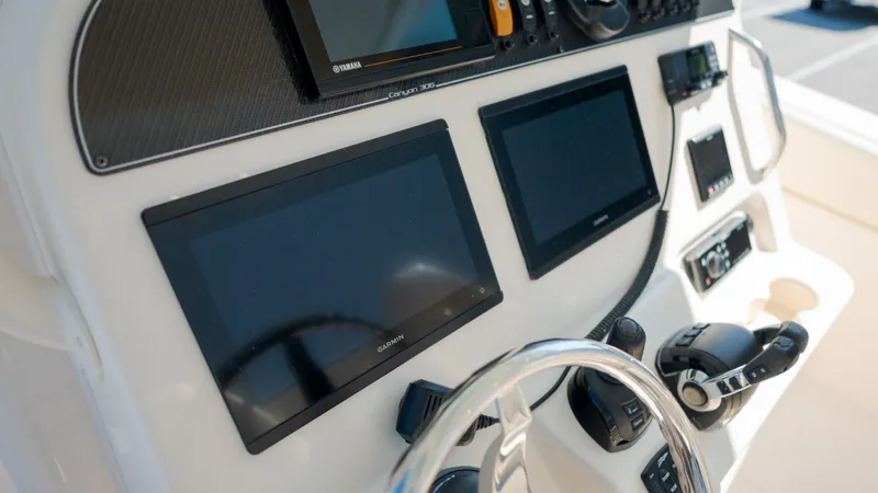 Slide: The Image of Dashboard of 2019 Grady-White Canyon 306 boat. - 24