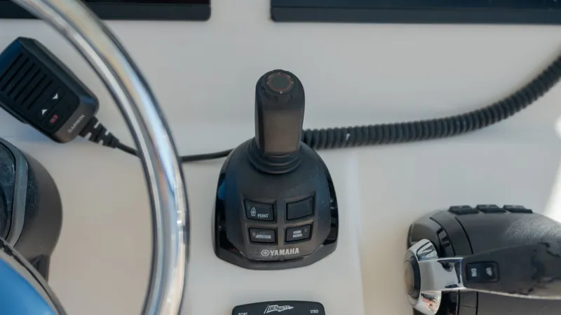 Slide: The Image of Yamaha joystick control on 2019 Grady-White Canyon 306. - 29